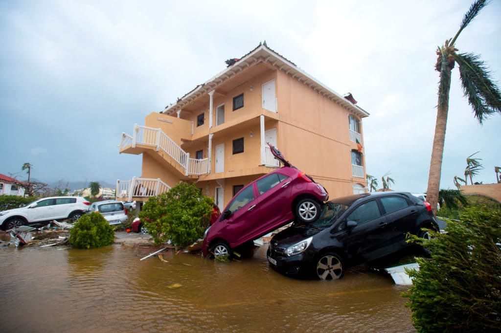 TOPSHOT - A photo taken on September 6, 2017 shows cars piled on top of one another in Marigot, near the Bay of Nettle, on the French Collectivity of Saint Martin, after the passage of Hurricane Irma. France, the Netherlands and Britain on September 7 sent water, emergency rations and rescue teams to their stricken territories in the Caribbean hit by Hurricane Irma, which has killed at least 10 people. The worst-affected island so far is Saint Martin, which is divided between the Netherlands and France, where eight of the 10 confirmed deaths took place. / AFP PHOTO / Lionel CHAMOISEAU (Photo credit should read LIONEL CHAMOISEAU/AFP/Getty Images)