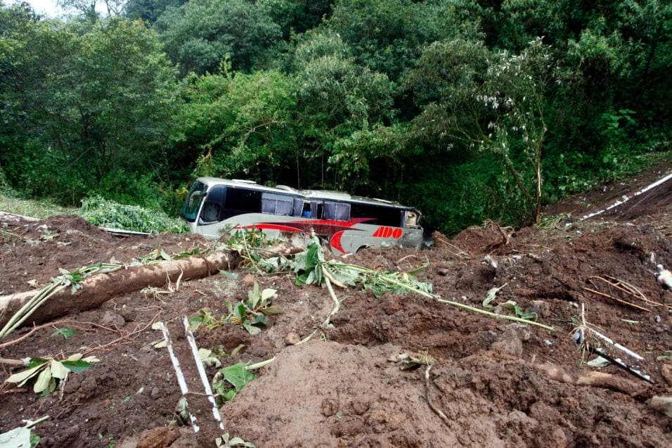 Bus swept away by mudslide near Tlaolo, in the Mexican state of Puebla
