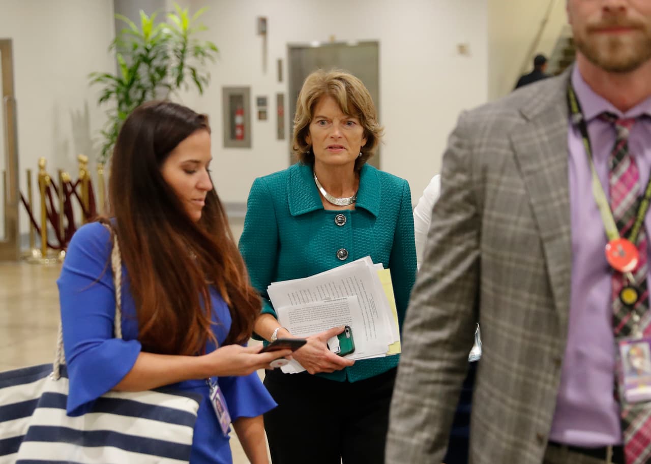 Sen. Lisa Murkowski, R-Alaska, waits to board the Senate subway car as she heads to her office after listening to Sen. Susan Collins, R-Maine, declare she would vote to confirm Brett Kavanaugh's Supreme Court nomination, on Capitol Hill, Friday, Oct. 4, 2018. (AP Photo/Pablo Martinez Monsivais)