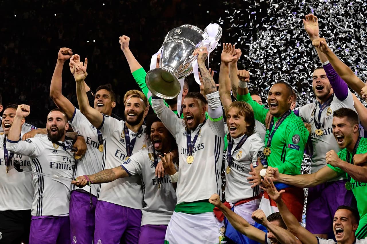 Real Madrid captain Sergio Ramos lifts the trophy after Real Madrid won the UEFA Champions League final football match between Juventus and Real Madrid at The Principality Stadium in Cardiff, south Wales, on June 3, 2017. / AFP PHOTO / JAVIER SORIANO (Photo credit should read JAVIER SORIANO/AFP/Getty Images)