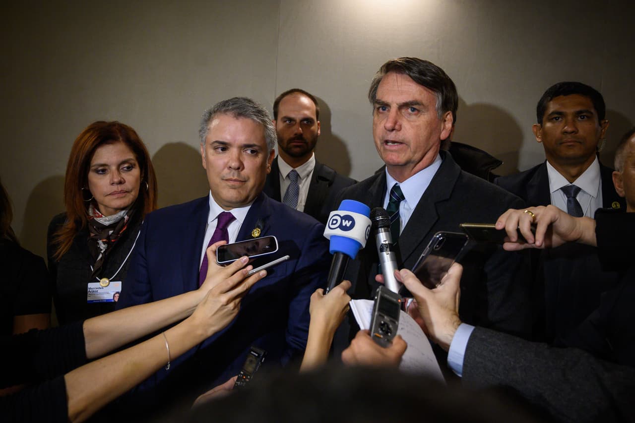 Brazilian President Jair Bolsonaro (L) delivers a statement next to President of Colombia Ivan Duque recognising Venezuelan opposition leader Juan Guaido as the interim President, on January 23, 2019 in Davos. - Brazil threw its support behind Juan Guaido as Venezuela's leader, after the head of the opposition-controlled parliament declared himself the interim president of his country in open defiance of President Nicolas Maduro. (Photo by Fabrice COFFRINI / AFP) (Photo credit should read FABRICE COFFRINI/AFP/Getty Images)
