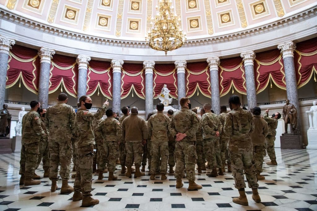 Members of the National Guard standing in Statuary Hall of the US Capitol in Washington, DC, January 13, 2021. National Guard missions are generally conducted to assist civil authorities whose capabilities or capability is insufficient to meet current requirements, including protecting American lives and critical U.S. infrastructure.