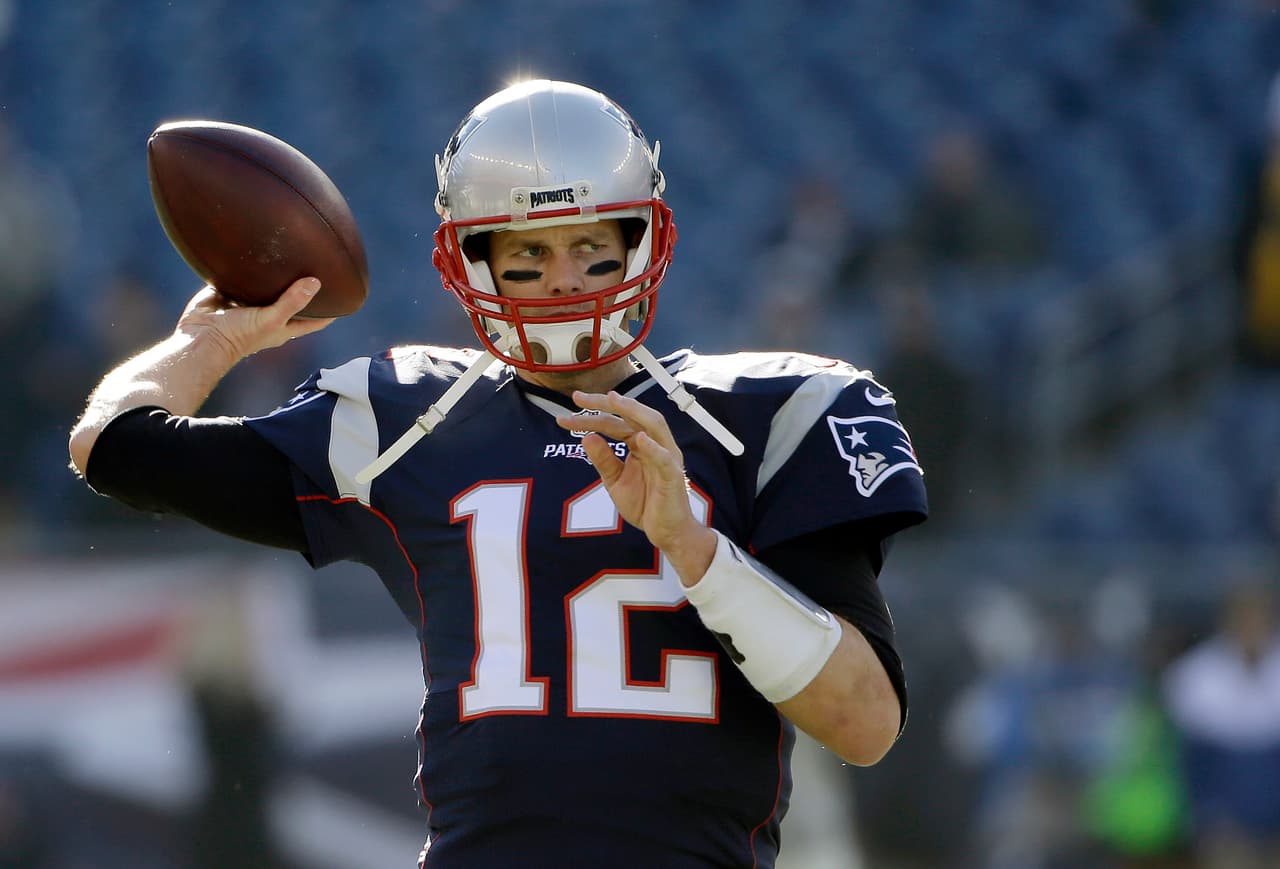 New England Patriots quarterback Tom Brady warms up before an NFL football game against the Los Angeles Rams, Sunday, Dec. 4, 2016, in Foxborough, Mass. (AP Photo/Elise Amendola)