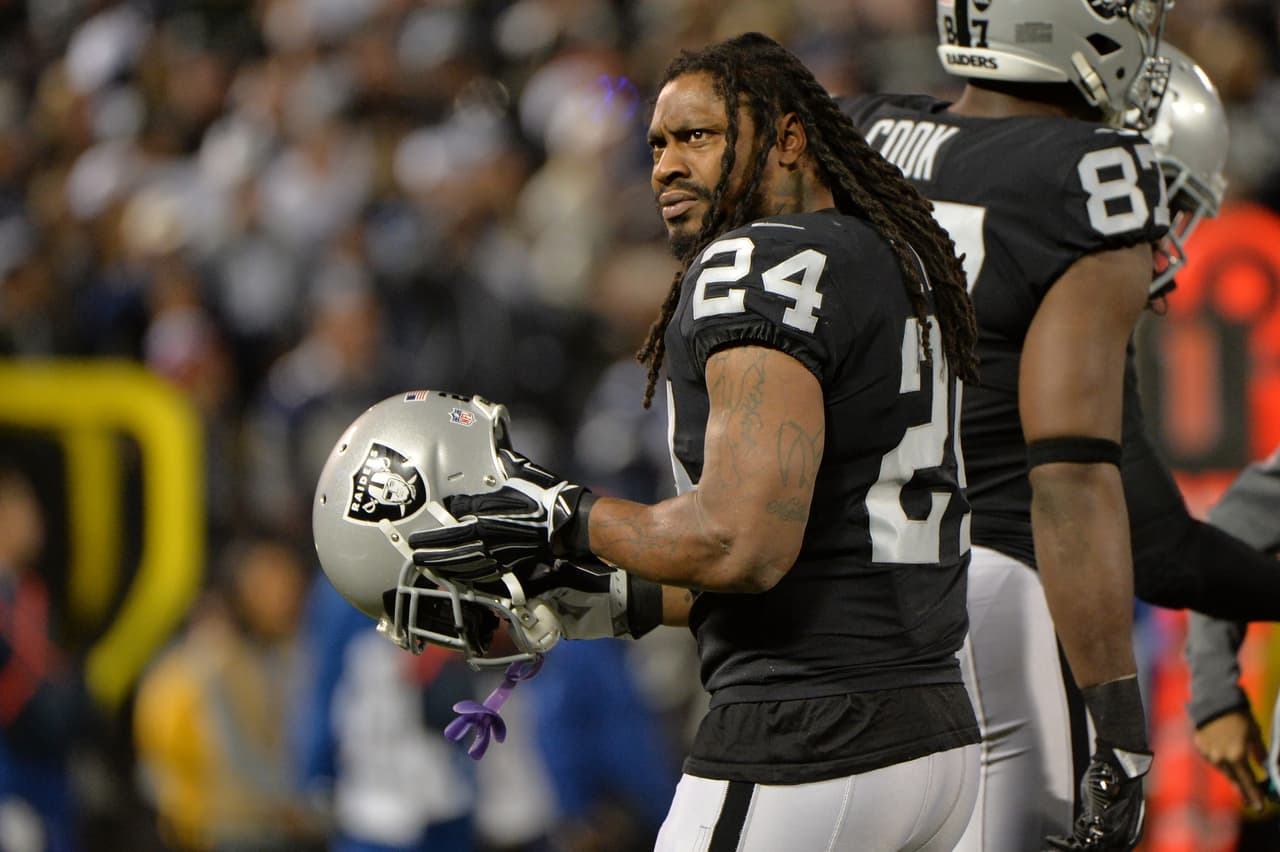 OAKLAND, CA - DECEMBER 17: Marshawn Lynch #24 of the Oakland Raiders looks on during their NFL game against the Dallas Cowboys at Oakland-Alameda County Coliseum on December 17, 2017 in Oakland, California. (Photo by Don Feria/Getty Images)