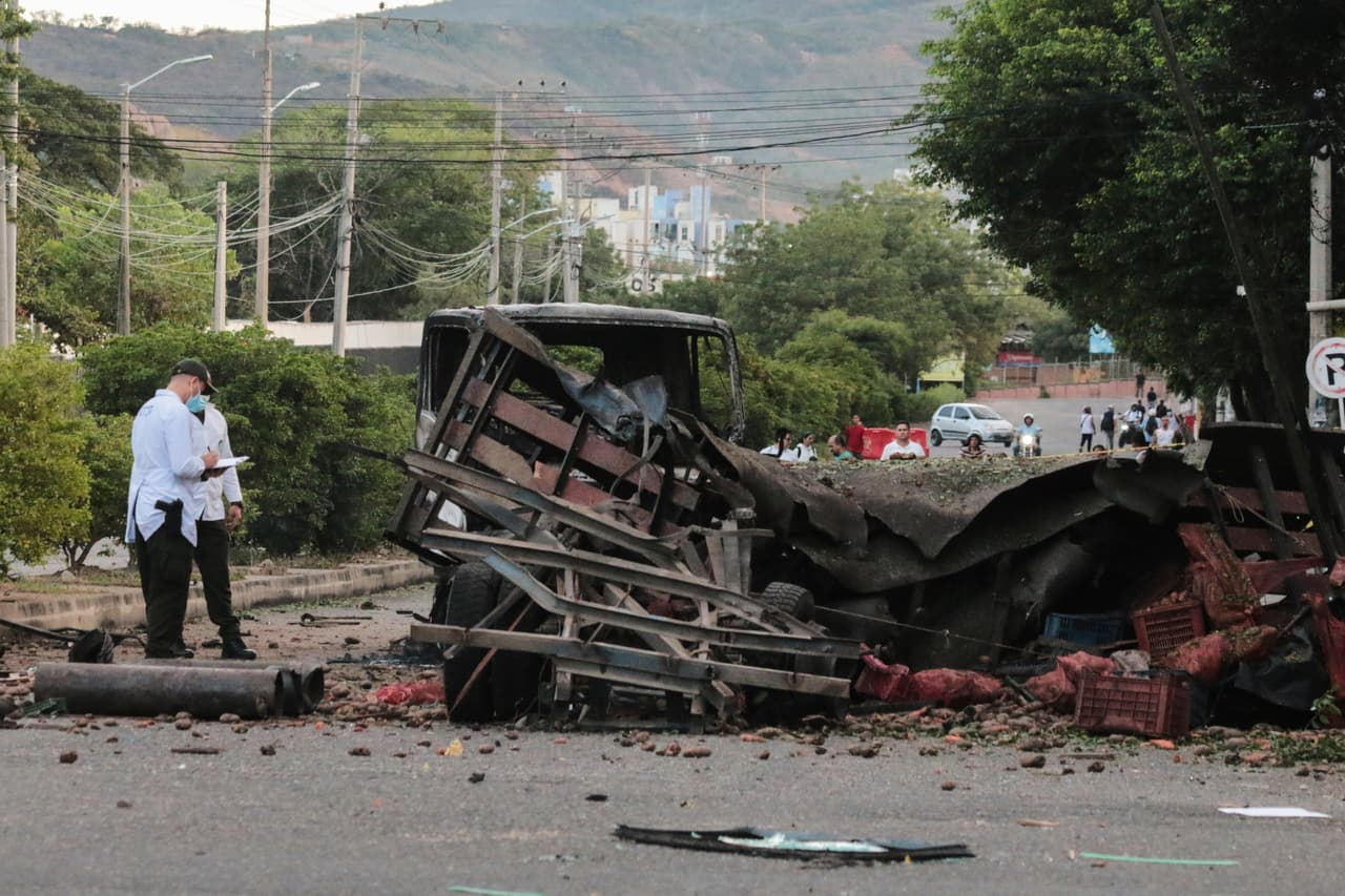Police inspect the scene after a truck exploded outside a police station in Cucuta, Colombia, Saturday, Aug. 1, 2026. (AP Photo/Mario Caicedo)