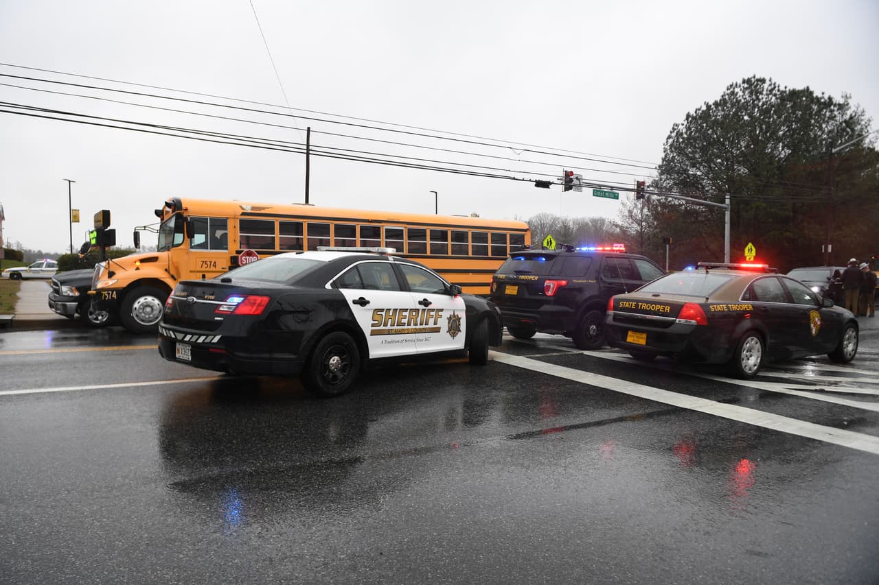 Sheriffs and Maryland State Troopers gather on March 20, 2018 at Great Mills High School in Great Mills, Maryland after a shooting at the school. A shooting took place at a high school in the eastern US state of Maryland on Tuesday, officials said, reportedly leaving several people injured just days before a nationwide student-organized march against school violence. Three people were shot in the incident at Great Mills High School, located about a 90-minute drive southeast of the US capital Washington, according to a county official quoted by The Baltimore Sun.Three people, including the assailant, were in critical condition after a shooting at a high school in the eastern US state of Maryland on Tuesday, officials said. / AFP PHOTO / JIM WATSON (Photo credit should read JIM WATSON/AFP/Getty Images)
