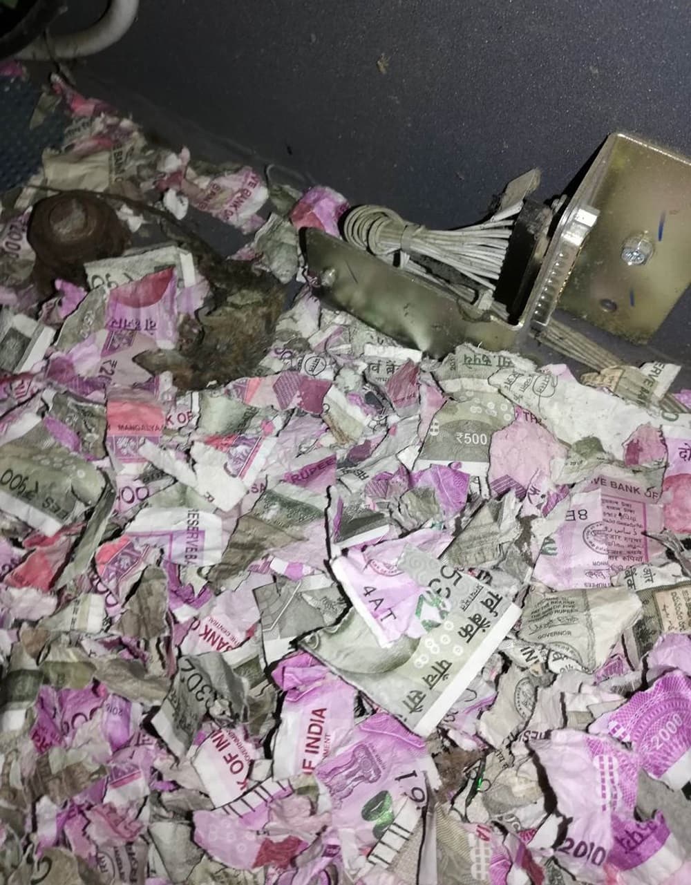 This picture taken on June 19, 2018, shows shredded Indian currency notes in 2000 and 500 rupee denominations after being eaten by rats in at ATM in Tinsukia in India's northeastern Assam state. - Indian police on June 21 said rats nibbled through more than a million rupees of banknotes after busting into a cash machine in the country's northeast. (Photo by - / AFP) (Photo credit should read -/AFP/Getty Images)