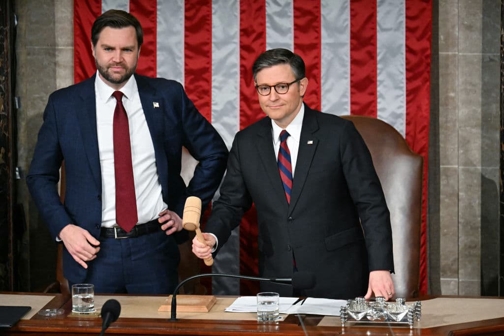 (L-R) US Vice President JD Vance looks on as Speaker of the House Mike Johnson hits the gavel ahead of US President Donald Trump's address to a joint session of Congress in the House Chamber of the US Capitol in Washington, DC, on March 4, 2025. (Photo by Jim WATSON / AFP) (Photo by JIM WATSON/AFP via Getty Images)