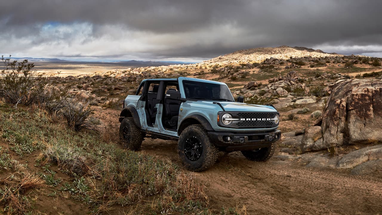Pre-production 2021 Bronco four-door Badlands series with available Sasquatch™ off-road package in Cactus Gray with the doors, top and rear quarter windows removed.