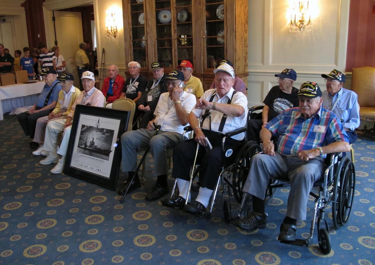 Survivors of the World War II sinking of the USS Indianapolis pose for a group photo on Friday, Aug. 2, 1945, during a survivors gathering in the ship’s namesake city that could be their final reunion. Only 38 of the 317 survivors who were pulled from the Pacific's shark-infested waters in August 1945 are still alive and they’re in their late 80s and early 90s. (AP Photo/Rick Callahan).