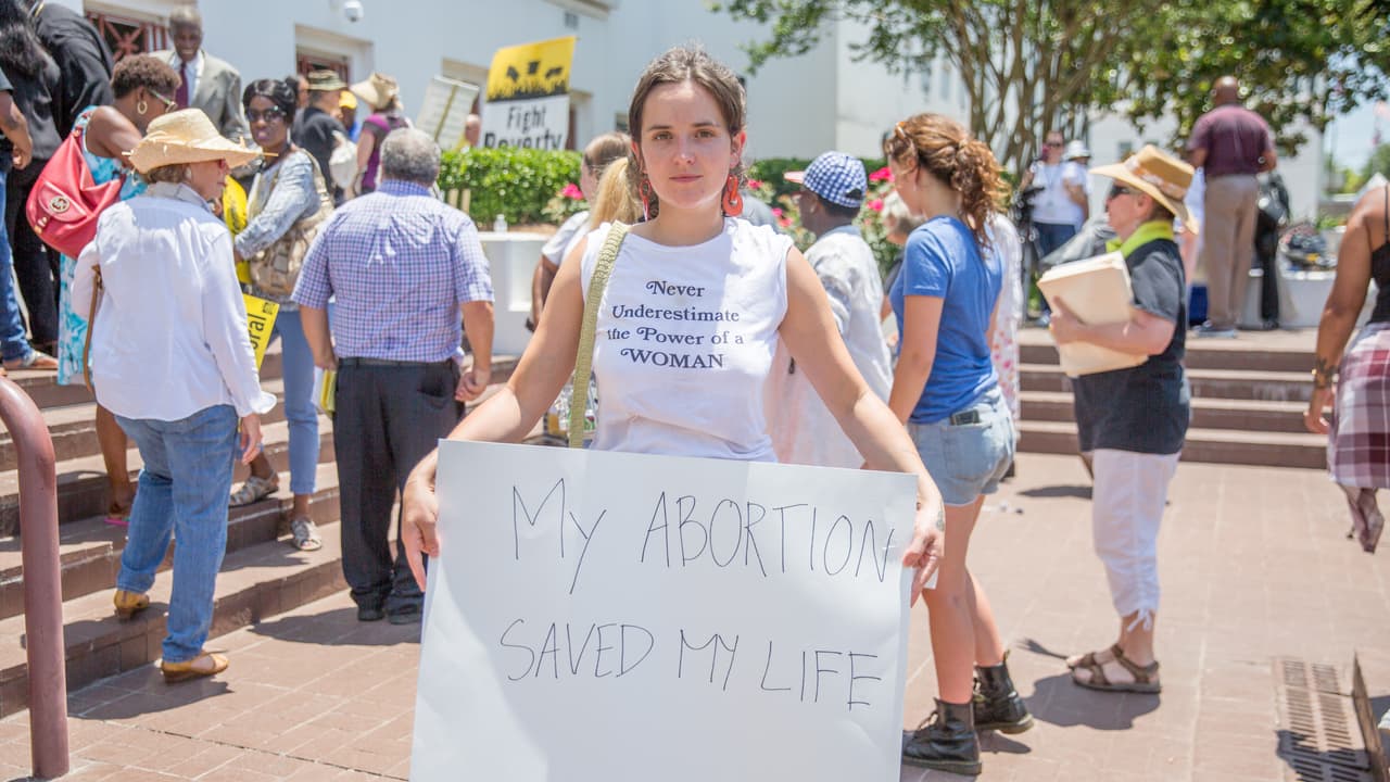 "My abortion saved my life," says this young woman who traveled from Tennessee to Montgomery to protest the legislation. She was in an abusive relationship when she underwent the procedure.
