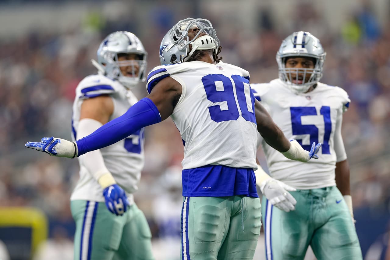 Dallas Cowboys defensive end Demarcus Lawrence (90) celebrates a sack during the game between the Detroit Lions and Dallas Cowboys on September 30, 2018 at AT&T Stadium in Arlington, TX.