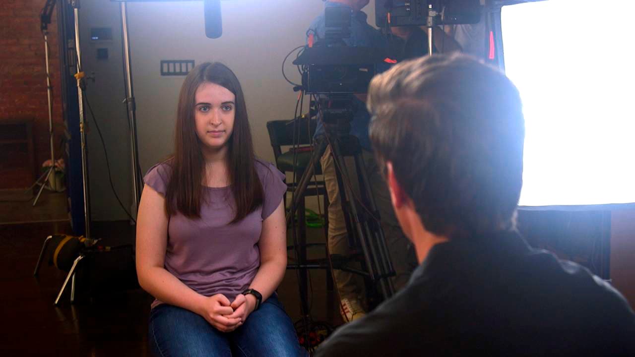 In this August 2019 photo provided by ABC News, Payton Leutner, left, is interviewed by ABC's David Muir. Leutner, of Wisconsin, survived a stabbing attack in 2014 by two teenage friends wanting to please a fictional horror character called Slender Man. In her first interview about the attack, which is set to air Friday, Oct. 25, Leutner told ABC News that despite her lingering trauma, she has "come to accept all of the scars that I have." (ABC News via AP)