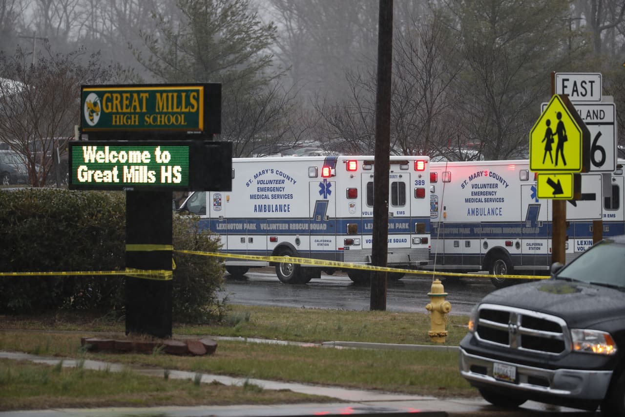 Deputies, federal agents and rescue personnel, converge on Great Mills High School, the scene of a shooting, Tuesday morning, March 20, 2018 in Great Mills, Md. (AP Photo/Alex Brandon )