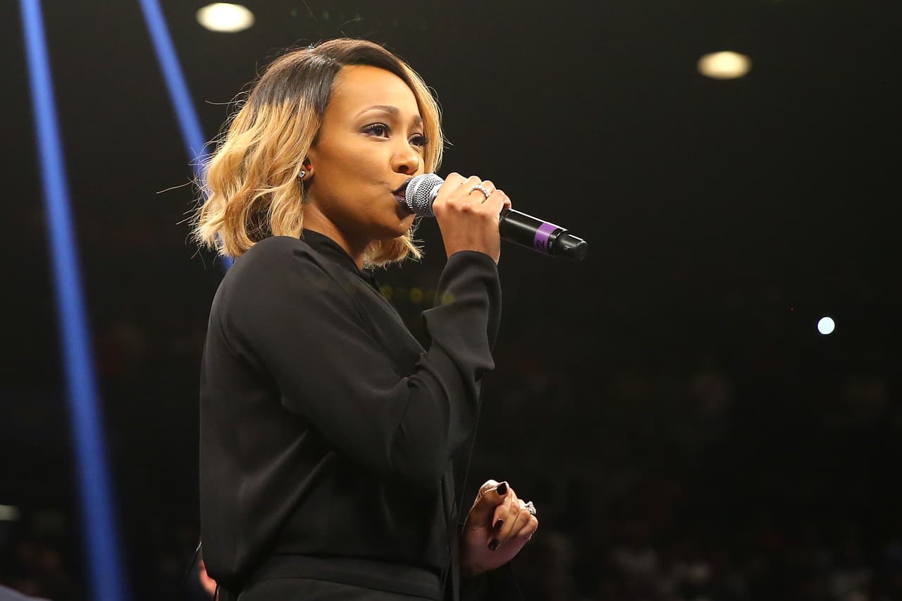 LAS VEGAS, NV - SEPTEMBER 13: Singer Monica performs the national anthem before Floyd Mayweather Jr. takes on Marcos Maidana for their WBC/WBA welterweight title fight at the MGM Grand Garden Arena on September 13, 2014 in Las Vegas, Nevada. (Photo by Al Bello/Getty Images)