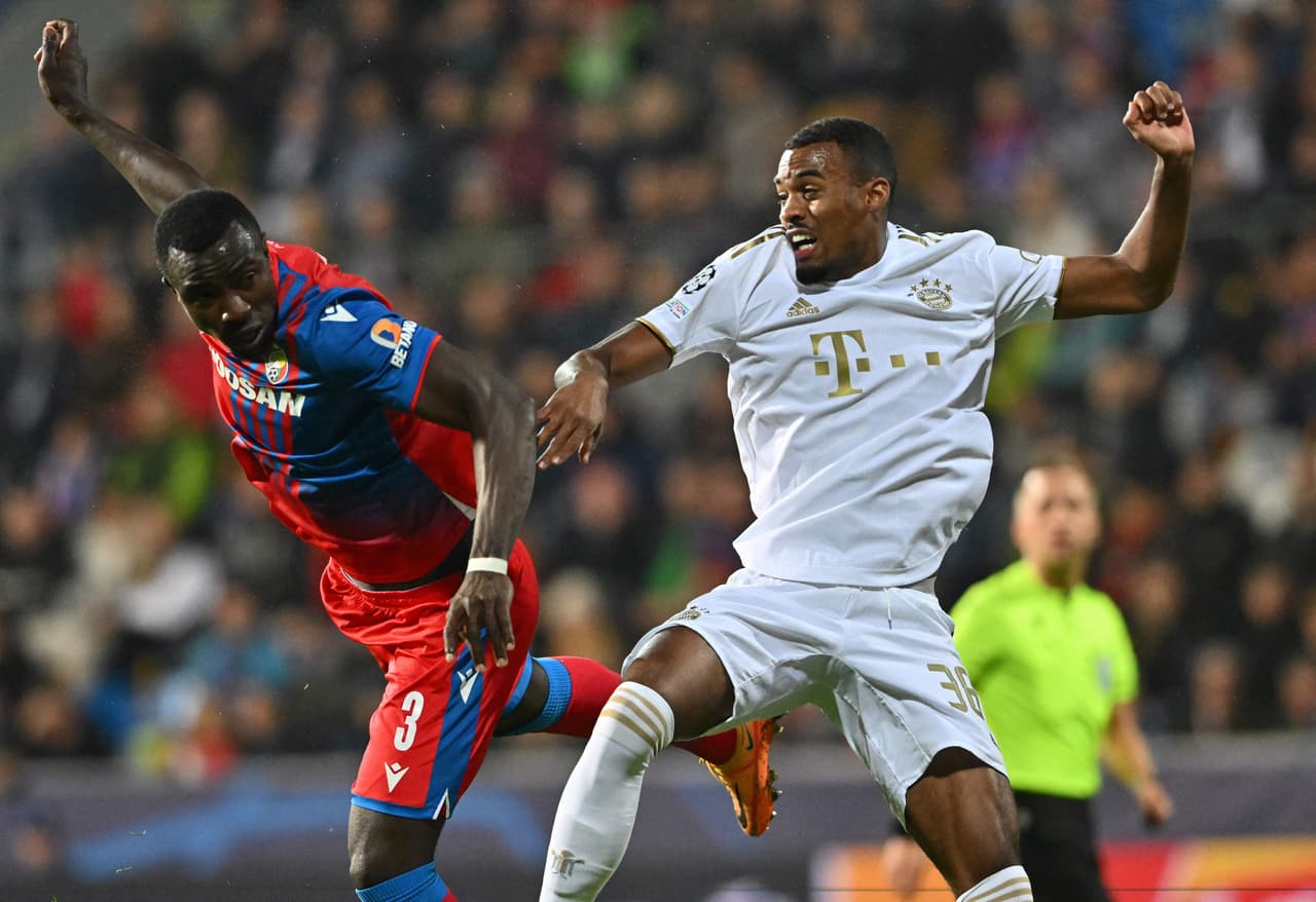Viktoria Plzen's Ivorian defender Mohamed Tijani (L) and Viktoria Plzen's Czech goalkeeper Jindrich Stanek vie for the ball during the UEFA Champions League Group C football match between FC Viktoria Plzen and FC Bayern Munich in Plzen, Czech Republic, on October 12, 2022. (Photo by Joe Klamar / AFP) (Photo by JOE KLAMAR/AFP via Getty Images)