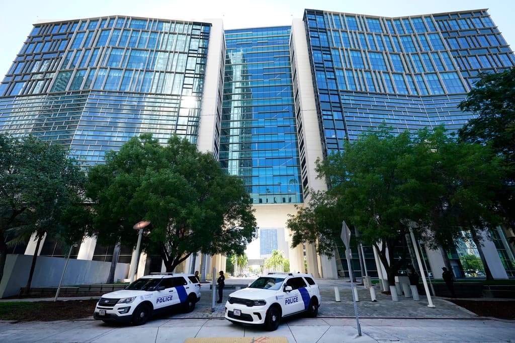 Federal Protective Service Police cars line the sidewalk outside the Wilkie D. Ferguson Jr. U.S. Courthouse, Monday, June 12, 2023, in Miami. Former President Donald Trump is set to appear at the federal court Tuesday, on dozens of felony charges accusing him of illegally hoarding classified information. (AP Photo/Wilfredo Lee)