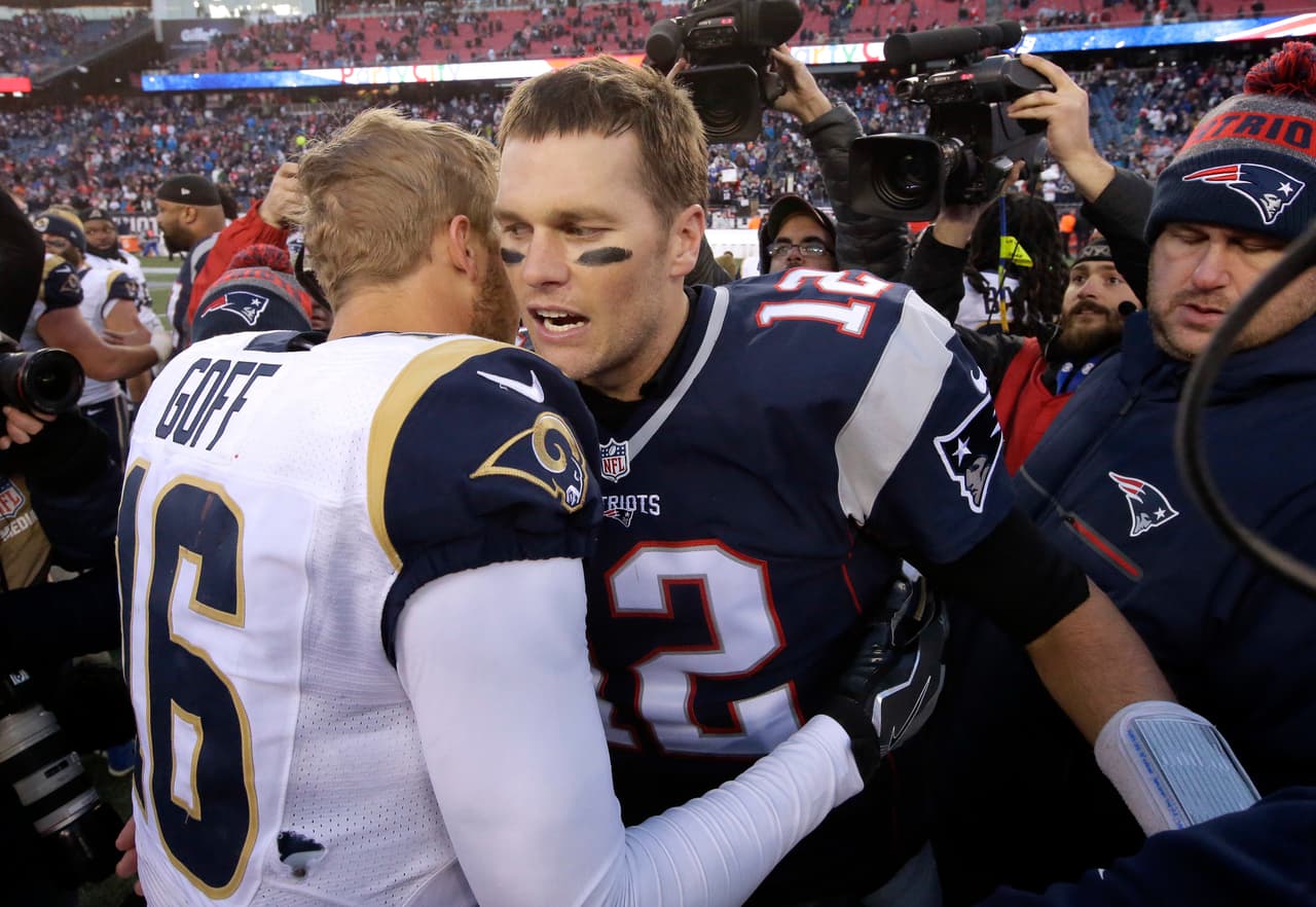 New England Patriots quarterback Tom Brady right, speak at midfield to Los Angeles Rams quarterback Jared Goff after an NFL football game, Sunday, Dec. 4, 2016, in Foxborough, Mass. The Patriots won 26-10. (AP Photo/Steven Senne)