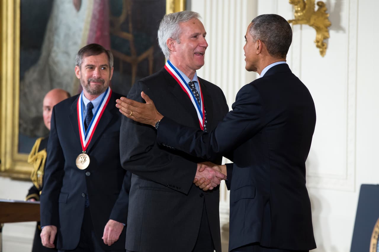 FILE - In this Thursday, Nov. 20, 2014, file photo, Douglas Lowy, left, and John Schiller, of the National Cancer Institute, National Institutes of Health are awarded the National Medal of Technology and Innovation by President Barack Obama, during a ceremony in the East Room of the White House in Washington. The Albert and Mary Lasker Foundation announced Wednesday, Sept. 6, 2017, that it awarded Lowy and Schiller of the U.S. National Cancer Institute its clinical research award. The public service award went to Planned Parenthood and the basic research prize went to Michael N. Hall of the Biozentrum Institute at the University of Basel. (AP Photo/Evan Vucci, File)