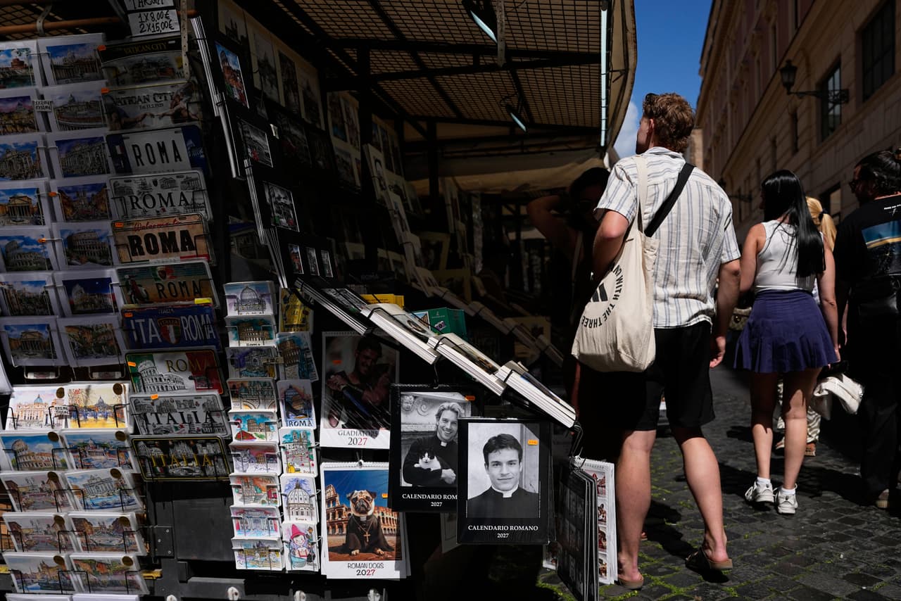 The 'Calendario Romano' calendar, bearing a photo of Giovanni Galizia, who is not a priest, is on sale in a souvenir shop in Rome, Wednesday, May 20, 2026. (AP Photo/Alessandra Tarantino)