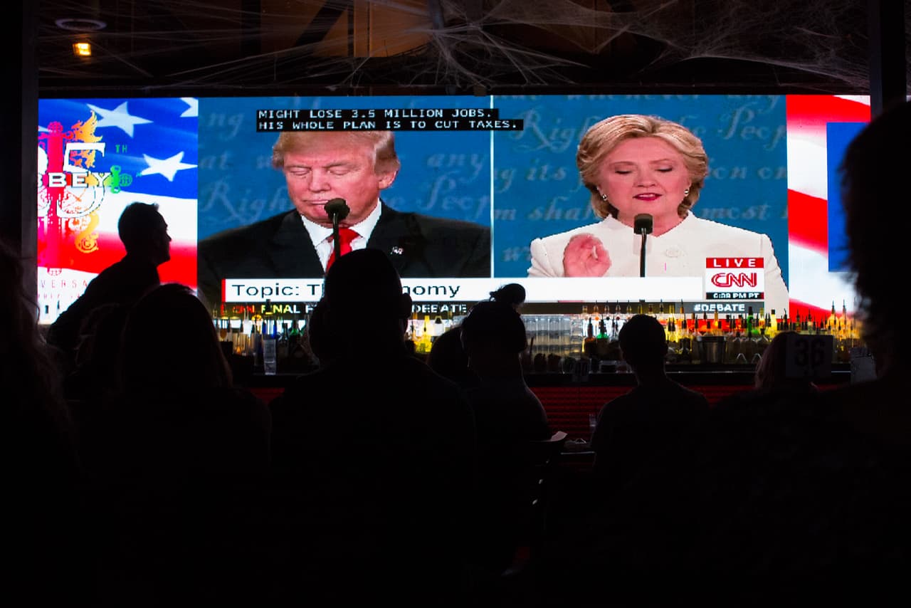 WEST HOLLYWOOD, CA - OCTOBER 19: People at The Abbey bar watch the third and final presidential debate between Republican Donald Trump and Democrat Hillary Clinton on October 19, 2016 in West Hollywood, California. This debate may be the last chance for Trump to catch up to Clinton in the polls before election day, on November 8. (Photo by David McNew/Getty Images)