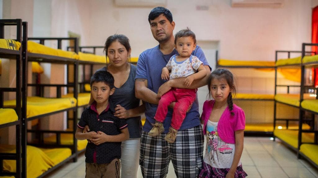 Misael Oláis, his wife Ericka Faustino and their three children, at a shelter for migrants in Nogales, Sonora. The family fled the violence and poverty of their region.