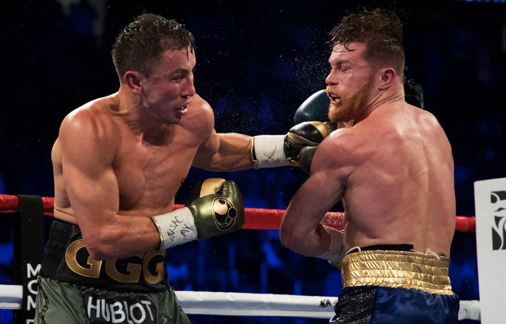 LAS VEGAS, NV - SEPTEMBER 16: Gennady Golovkin punches Canelo Alvarez during their WBC, WBA and IBF middleweight championship bout at T-Mobile Arena on September 16, 2017 in Las Vegas, Nevada. (Photo by Al Bello/Getty Images)
