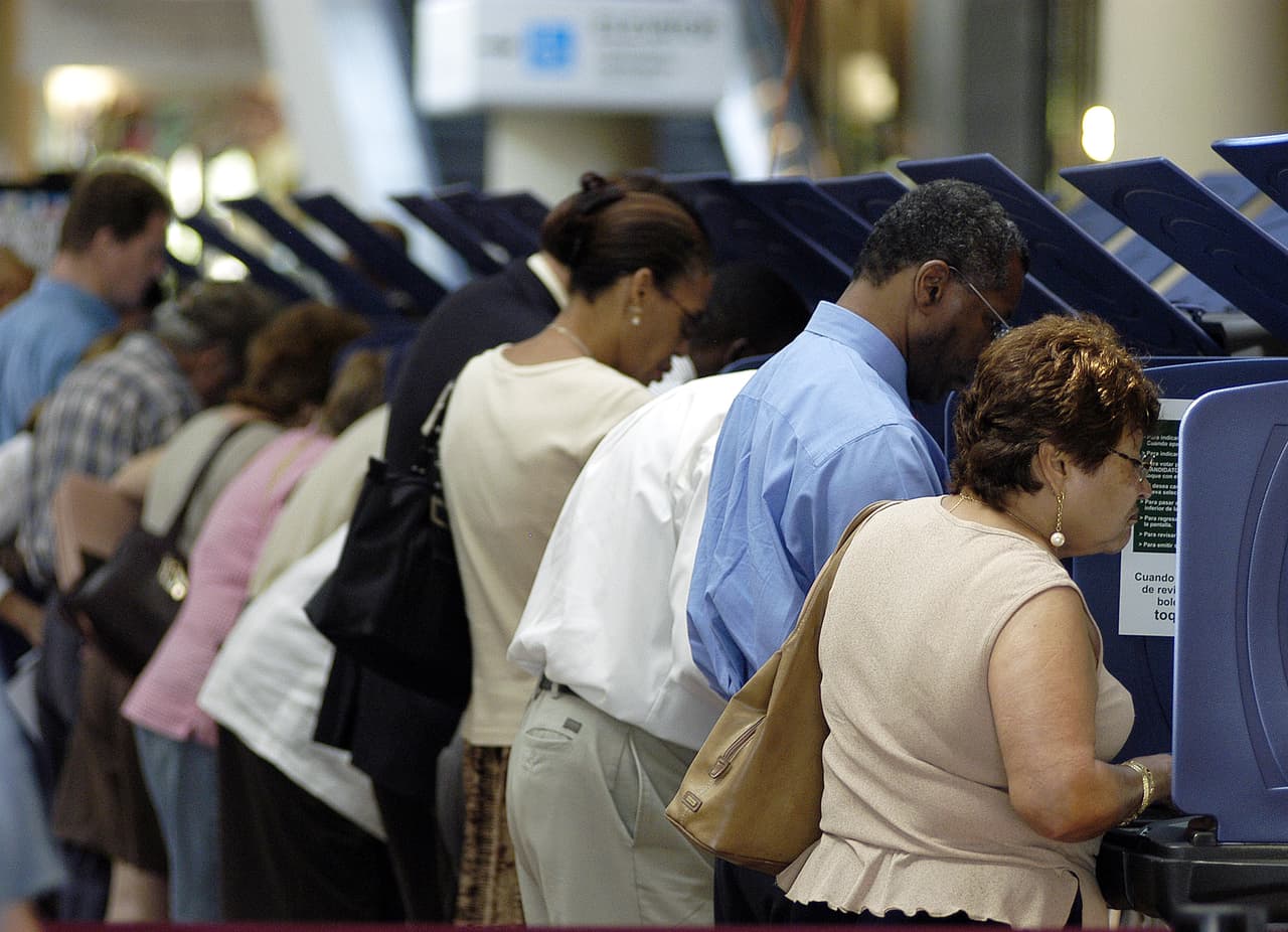 MIAMI - OCTOBER 21: Hispanic voters go to the polls for early voting at the Miami-Dade Government Center on October 21, 2004 in Miami, Florida. Early voting began this week in Florida and is under heavy scrutiny after the debacle in the 2000 election. (Photo by G. De Cardenas/Getty Images)