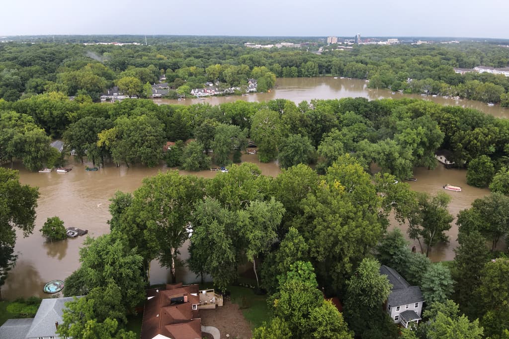 This aerial photo provided by the Indianapolis Fire Department shows flooding in northern Indianapolis, Ind., Saturday, Aug. 15, 2026. (Indianapolis Fire Department via AP)