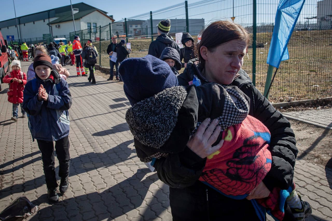 Ukrainian refugees arrive at the crossing border in Medyka, southeastern Poland, on Friday, March 11, 2022. Thousands of people have been killed and more than 2.3 million have fled the country since Russian troops crossed into Ukraine on Feb. 24.