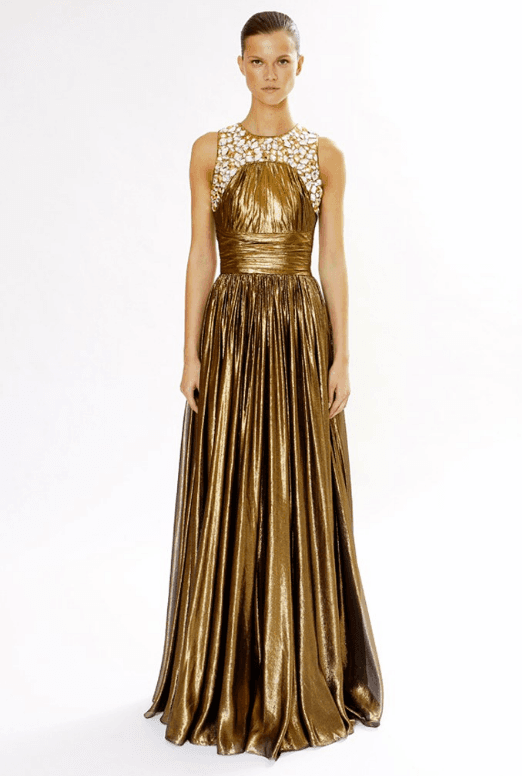 El suntuoso vestido de corte griego y piedras en el top fue diseñador por
<b>Michael Kors </b>para su coelcción
<b>Resort 2012-2013.</b>