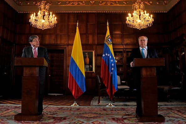 Colombian Foreign Minister Carlos Holmes Trujillo (L) and Humberto Calderon, appointed as Venezuelan ambassador to Colombia by opposition leader Juan Guaido, recognized by some 50 countries as Venezuela's interim president, offer a press conference at San Carlos Palace in Bogota on February 11, 2019. (Photo by Diana SANCHEZ / AFP) (Photo credit should read DIANA SANCHEZ/AFP/Getty Images)