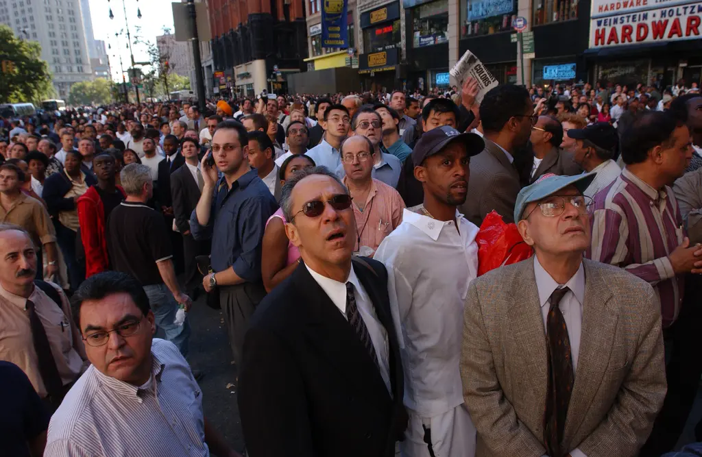 394261 158: People watch World Trade Center burn September 11, 2001 after two hijacked airplanes slammed into the twin towers in New York City. (Photo by Spencer Platt/Getty Images)